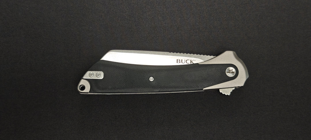 Manche en aluminium anodisé gris avec insert en micarta du Buck HiLine XL.