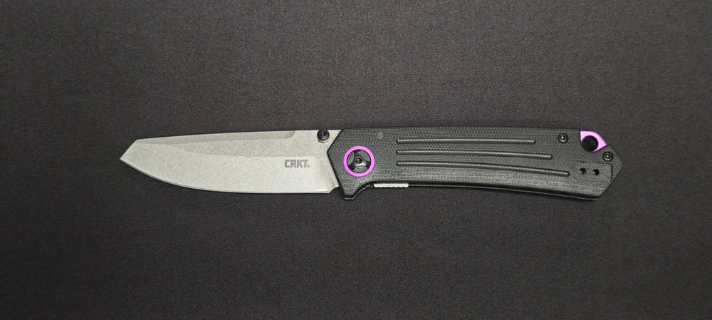 CRKT Montosa conçu par Richard Rogers avec manche en G10 noir et violet.
