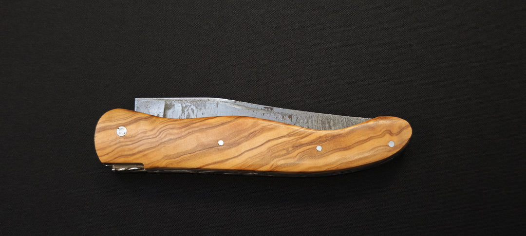 El cuchillo de caza Fidèle Laguiole mango integral de madera de olivo + hoja templada en bruto