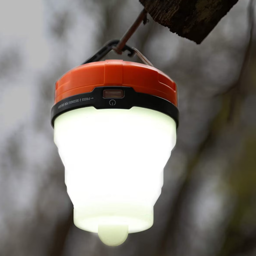 Lanterne LED pliable avec globe en silicone rétractable.